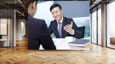 asian business people talking in office Wall mural