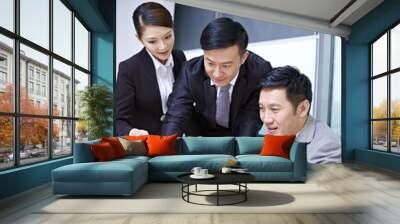 asian business team working together in office Wall mural