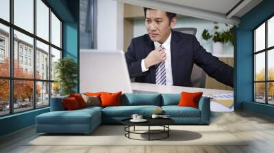 asian businessman working in office Wall mural