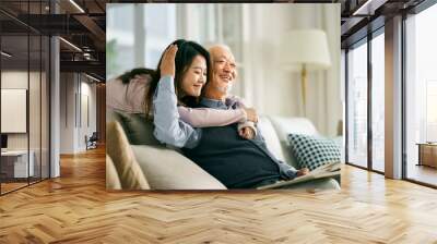 asian elderly father and adult daughter having a good time Wall mural