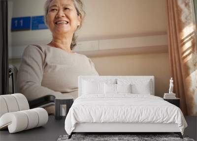 happy old woman sitting in wheelchair in nursing home Wall mural