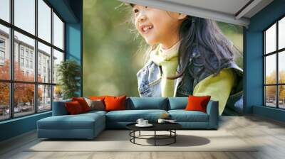 outdoor portrait of a little asian girl happy and smiling Wall mural