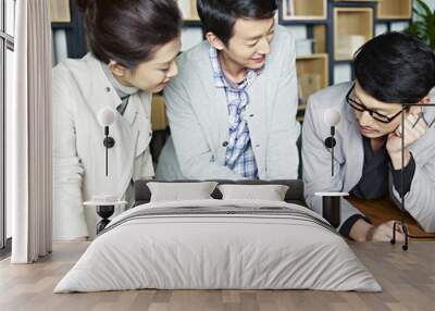 young asian business people working together in office Wall mural