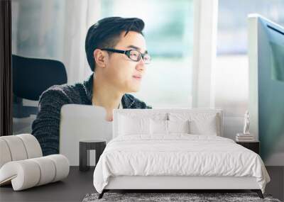 young asian businessman working in office Wall mural