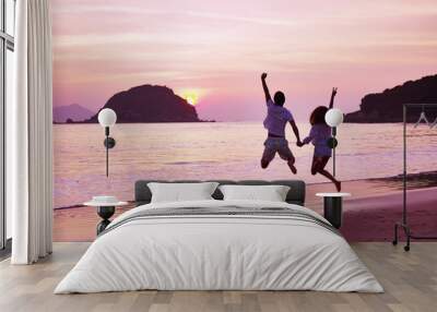 young asian couple rejoicing at sunrise Wall mural