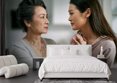 young asian daughter comforting elderly mother Wall mural