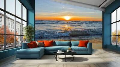 Brilliant sunrise over the waters of lake Huron in Oscoda, Michigan Wall mural