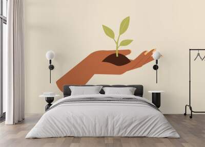 An African hand holding sprout. Plant a tree. Hand giving a plant. Earth day. Environment. Vector illustration cartoon flat style Wall mural