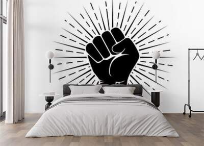 Human black hand raised arm clenched his fist in the fight for liberty. Black arm silhouette. Wall mural