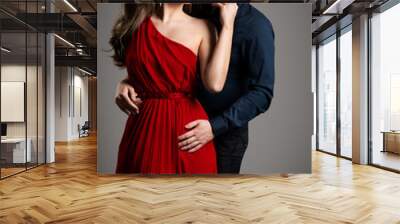 Couple Fashion Beauty, Beautiful Woman in Red Dress and Elegant Man Studio Portrait Wall mural