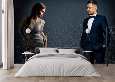 Fashion Luxury Couple. Glamour Woman and Handsome Man. Elegant Pair in evening Dress and Suit. Sparkling Background Wall mural