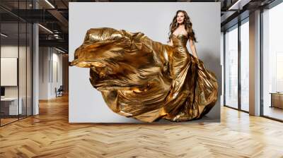 Woman in Golden Dress Flying on Wind, Happy Beautiful Lady in Fluttering Sparkling Gold Gown Wall mural