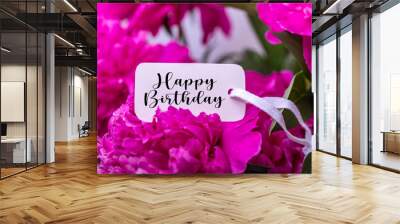 Happy Birthday greeting card on pink flower. Roses flowers and petals background. Wall mural