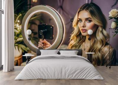 Beautiful Blonde Woman with Ring Light Filming in Glamorous Setting Wall mural