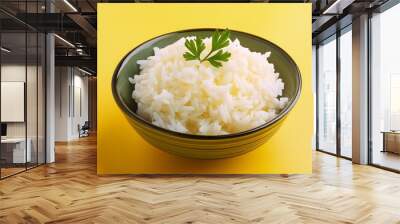 Boiled cooked white Basmati rice on yellow background Wall mural