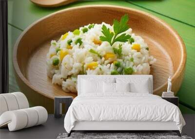 Delicious healthy vegetable basmati rice on green wooden background Wall mural