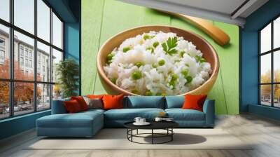 Delicious healthy vegetable basmati rice on green wooden background Wall mural