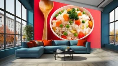 Delicious healthy vegetable basmati rice on red background Wall mural