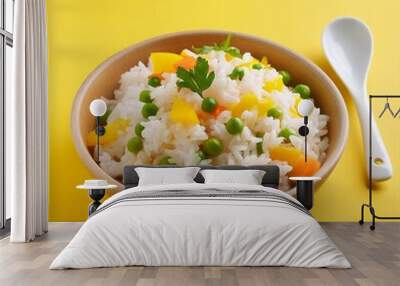 Delicious healthy vegetable basmati rice on yellow background Wall mural