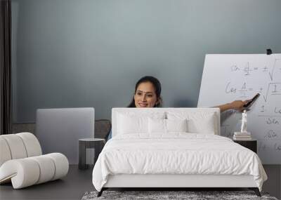 A woman teaching in an online class. Wall mural