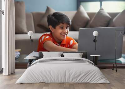 YOUNG KID ATTENDING HIS ONLINE CLASS IN ENTHUSIASM	 Wall mural