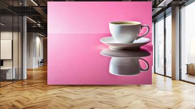 A single white cup of coffee on a white saucer reflecting on a pink surface Wall mural