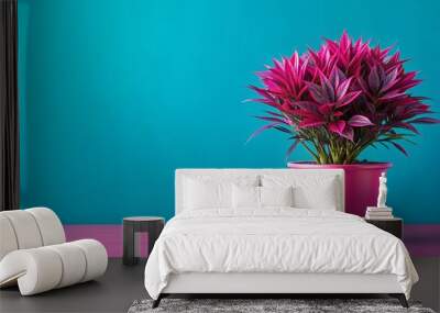 Vibrant pink plant in matching pot and surroundings Wall mural