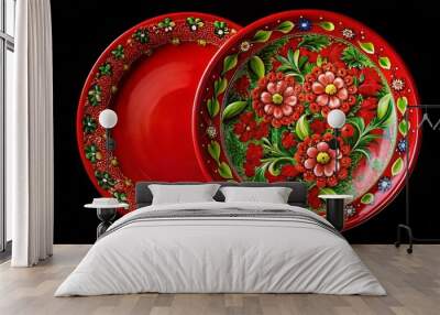 Vibrant red plate with floral and green decorations on black background Wall mural