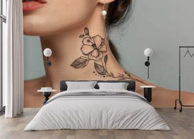 Delicate Floral Tattoo on Woman's Shoulder. Close-up view of a woman's collarbone featuring a detailed floral tattoo in minimal style, copy space. Wall mural