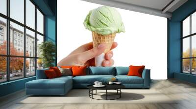 Female hand holding ice cream in waffle cone isolated on transparent background, clipart, cutout, png. Green milk ice-cream. Wall mural