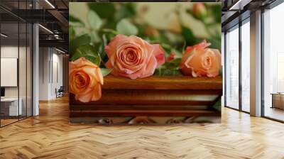 Fresh rose flowers lay on a carved wooden coffin. Ritual services, organization of funeral ceremony. Wall mural