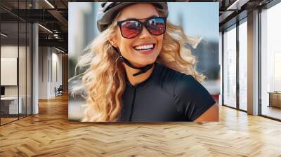 Portrait of a happy smiling young woman dressed in cycling clothes, safety helmet and sunglasses riding a bicycle, closeup. Active sport horizontal banner.  Wall mural