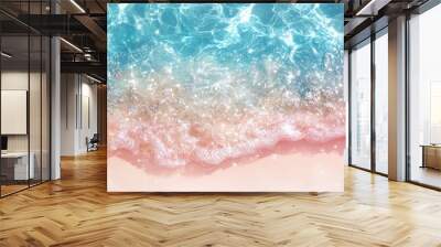 Shining sunny coastline with pink sand and texture of crystal clear sea water, foam and waves. Summer background with copy space Wall mural