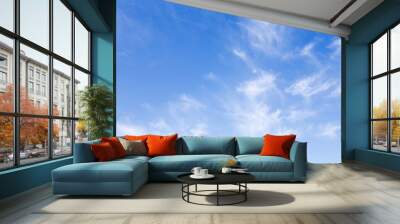 Blue sky background with a white clouds. Wall mural