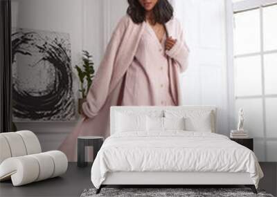 Fashion style model sexy pretty woman perfect body shape dark tanned skin brunette hair wear stylish trend clothes beige coat in interior designed decoration room home or hotel romantic date, party. Wall mural