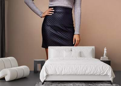 Sexy beauty woman pretty face wear grey sweater skinny short lather skirt body shape makeup cosmetic winter collection studio catalog brunette accessory clothes for office casual dress code fashion. Wall mural