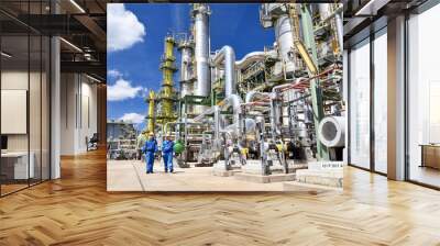 chemical industry plant - workers in work clothes in a refinery with pipes and machinery Wall mural