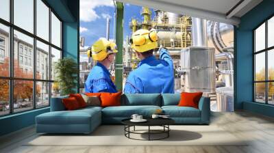 chemical industry plant - workers in work clothes in a refinery with pipes and machinery Wall mural