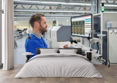 engineering in microelectronics: workers in the production and assembly of electronic high tech components in a modern factory Wall mural