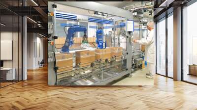 medical products manufacturing in a modern factory - worker operates modern industrial plant Wall mural