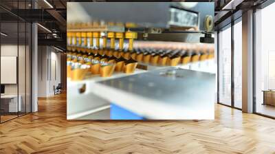 Production of pralines in a factory for the food industry - automatic conveyor belt with chocolate Wall mural