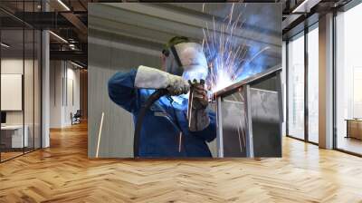 welder works in metal construction - construction and processing of steel components Wall mural