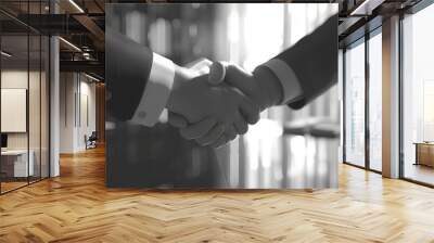 black and white handshake between business partners in a sleek modern office sealing a deal Wall mural