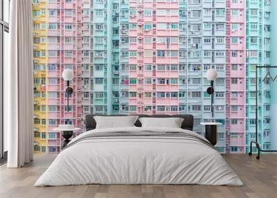 Photorealistic photo of urban apartment buildings arranged in symmetrical vertical patterns, featuring rows and columns of windows with pastel colors Wall mural