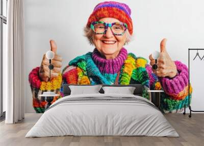 Senior citizen in vibrant LGBTQ+ clothing giving thumbs up with a happy expression on isolated white background reflecting joy Wall mural