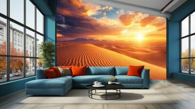 Vast desert landscape with golden dunes stretching to the horizon under a dramatic sunset sky highlighting nature's beauty Wall mural