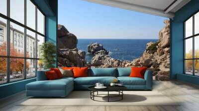 Blue sea and sky framed by red rocks on Sardinia, Italy Wall mural