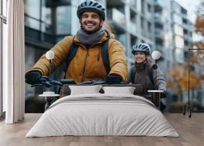 Couple riding bicycles through the city on a cold day Wall mural