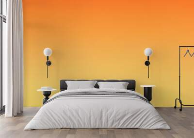 Orange light from the setting sun silhouettes mountain ridges against a colorful sky, capturing the serene beauty of a desert landscape. Wall mural