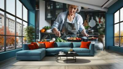 Elegant senior woman preparing healthy food Wall mural